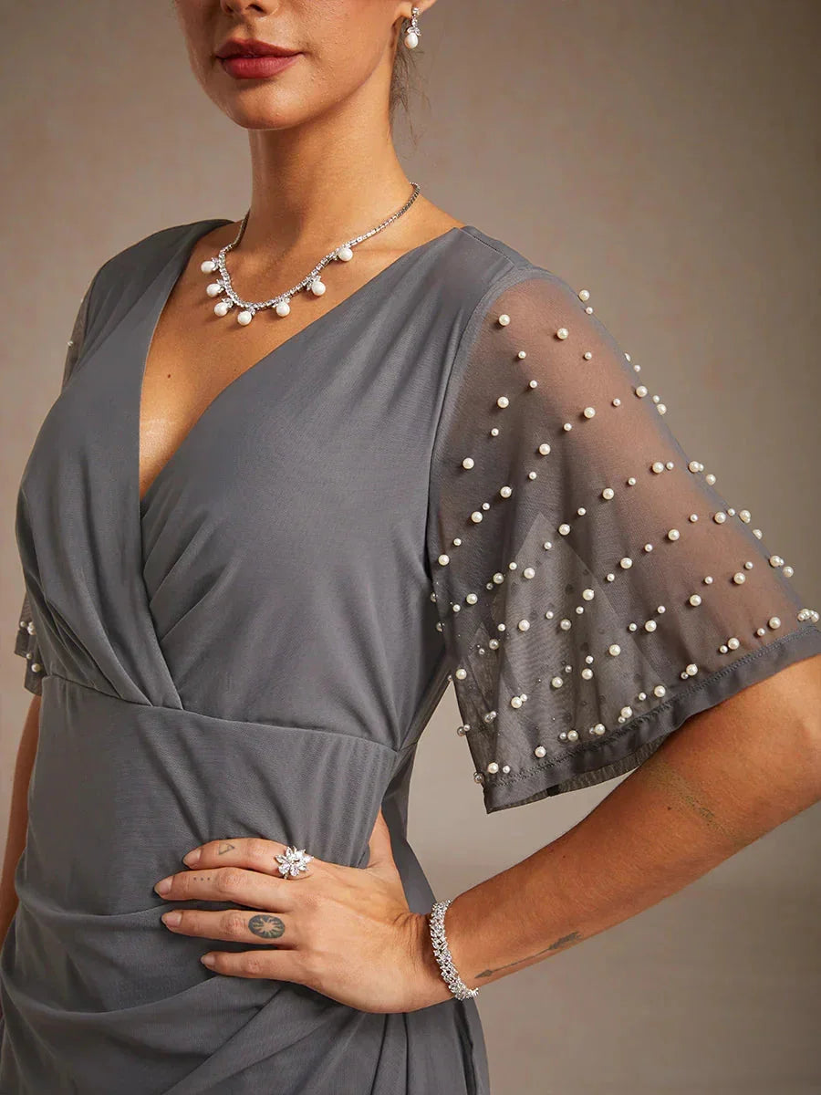 Elegante Formele Galajurk met Versierde Fladdermouwen