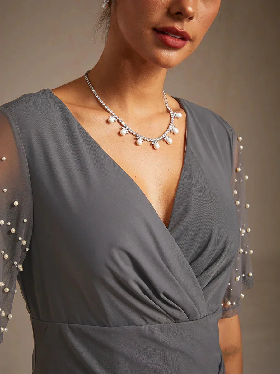 Elegante Galajurk met Versierde Fladdermouwen