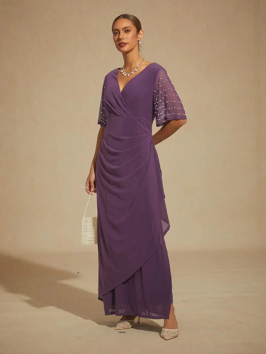 Elegante Formele Galajurk met Versierde Fladdermouwen