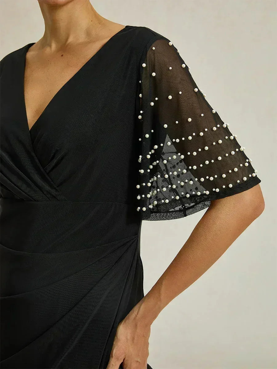 Elegante Formele Galajurk met Versierde Fladdermouwen
